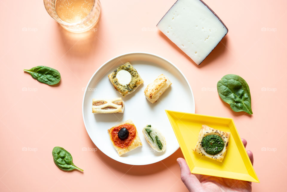 Flat lay of a person taking an appetizer plate 