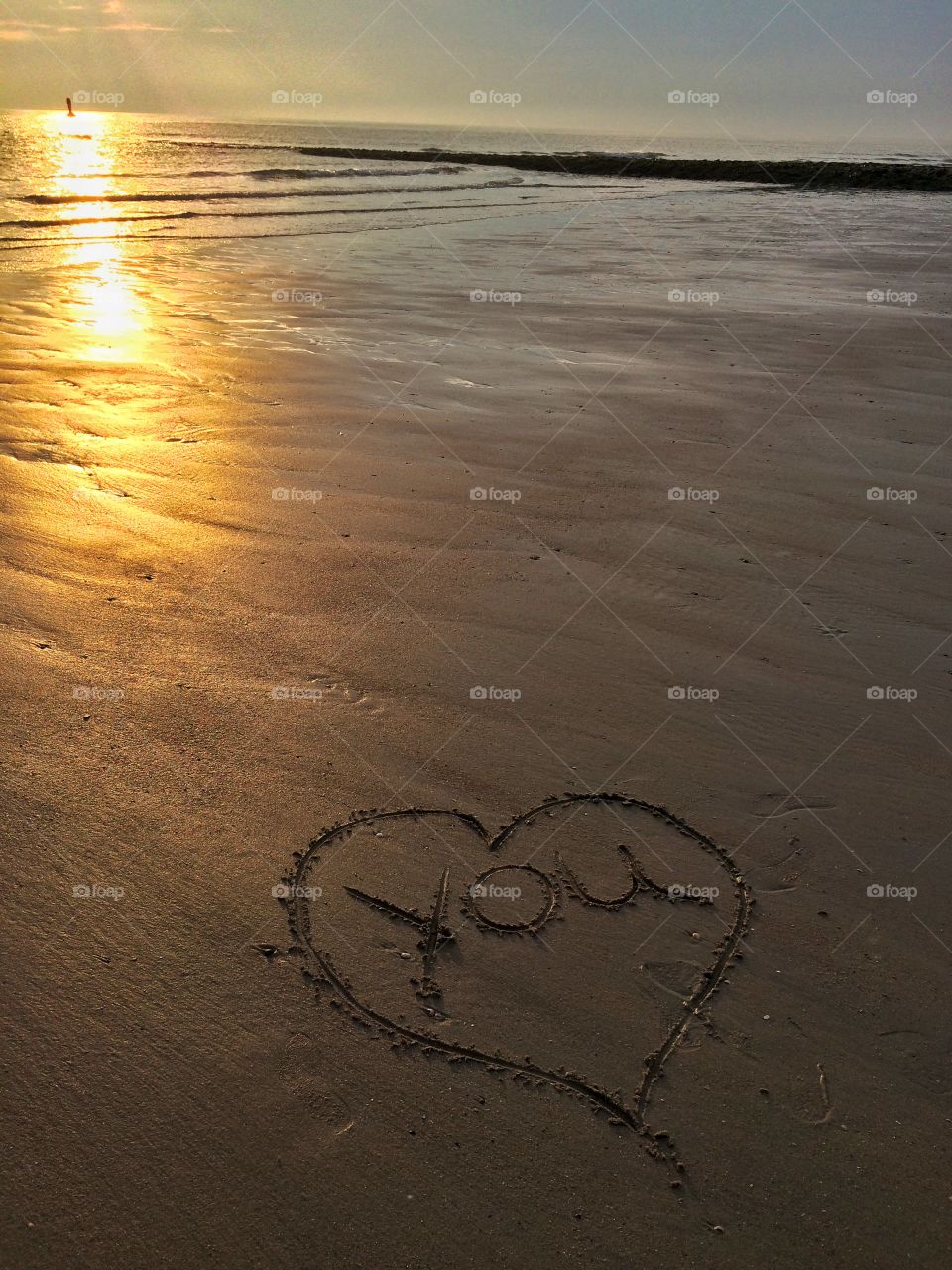 Heart with "you" in the sand. Just an idea... But the heart becomes a little ugly :D
