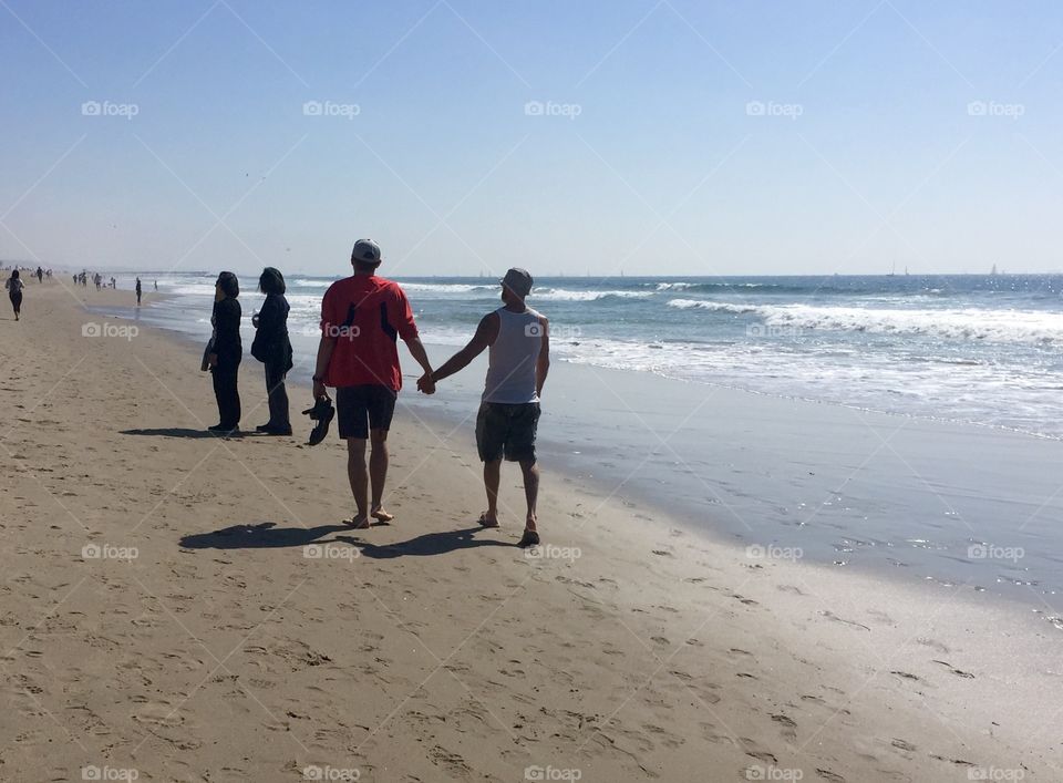 Gay couple on beach