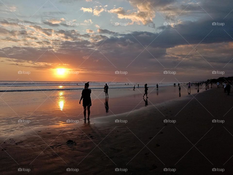 Beautiful atmosphere on Bali beach at sunset.