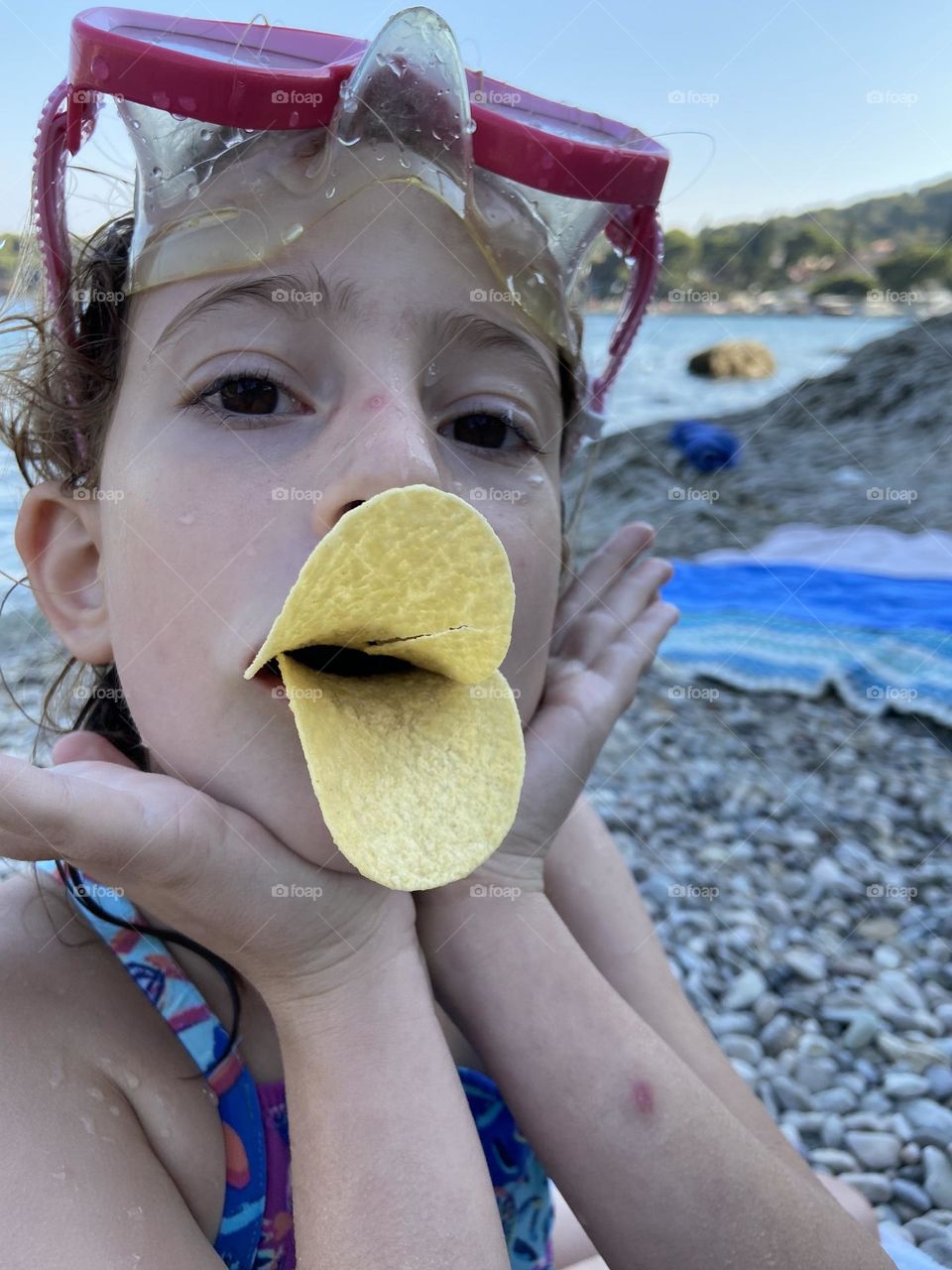 Look Mom! I am a duck. Quack Quack. Creating a duck bill with Pringles.