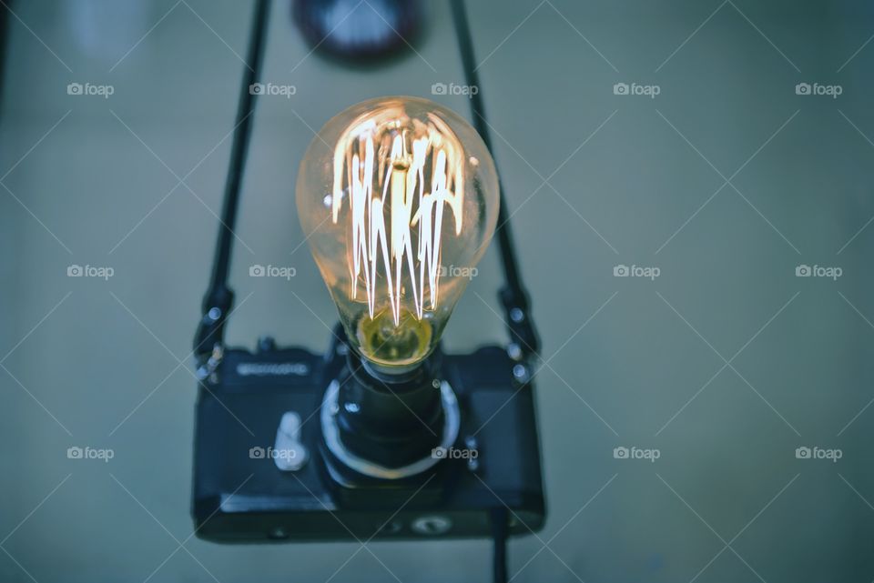 Illuminated light bulb on camera