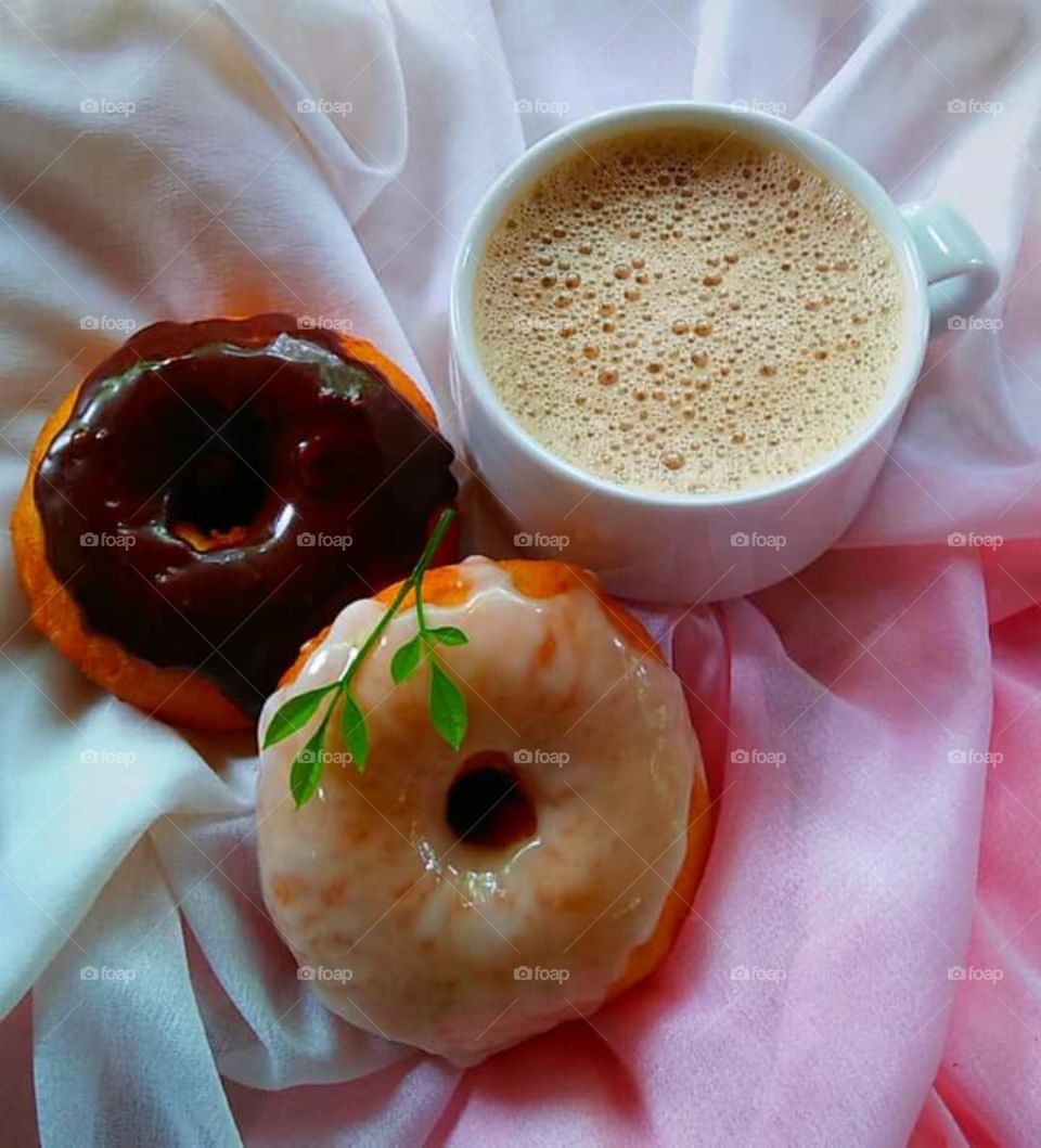 Fluffy , pillowy , yummy and delicious donuts .