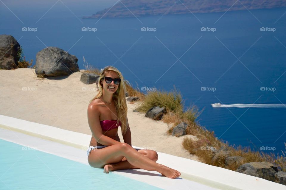 Roccabella Santorini resort. Amazing landscape, view from the hotel swimming pool. Happy with my diva sunglasses ! Picture taken during my honeymoon in Santorini, Greece, Ciclades Islands. View of the vulcano's caldera. Blue sky, blue sea. It was just the perfect holiday, the place to be, 