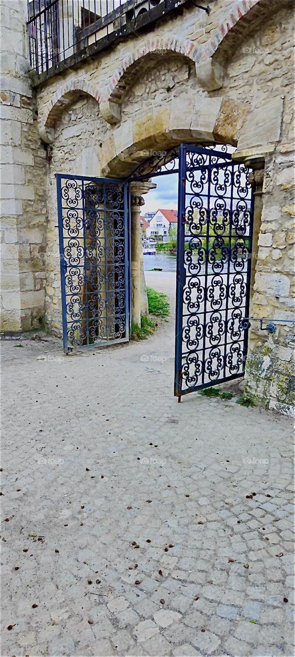 This beautiful cast iron work of art is the “Ostentor”, a historic gate to the city of “Regensburg” by the river “Danube” or “Donau” in “Bavaria”, Germany. 2024. Hypnotic Productions