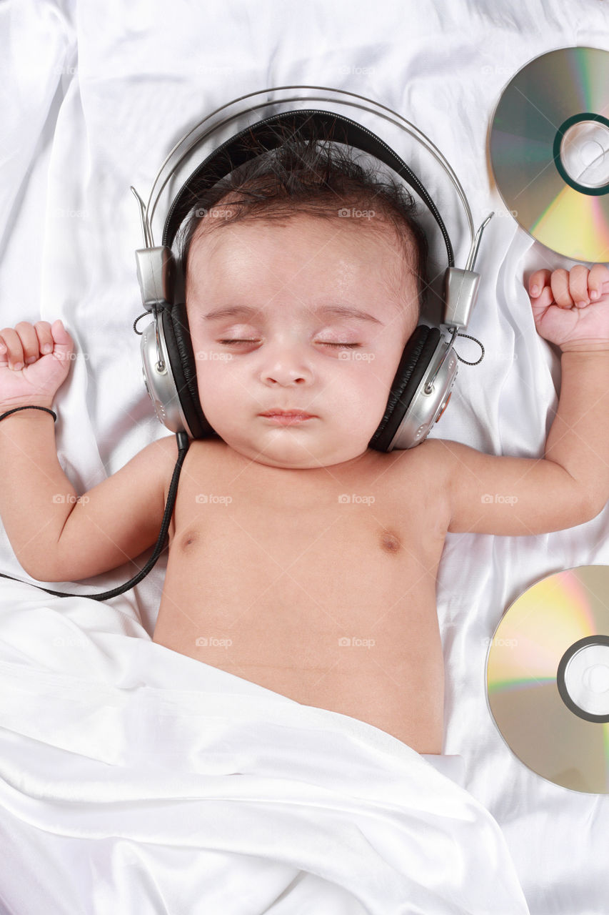 Baby listening to the music while sleeping