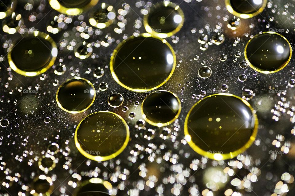 Golden oil Bubbles Close Up background amazing colours droplets of life in black texture macro look summer mood positive vibes wonderful day hustling daydreaming