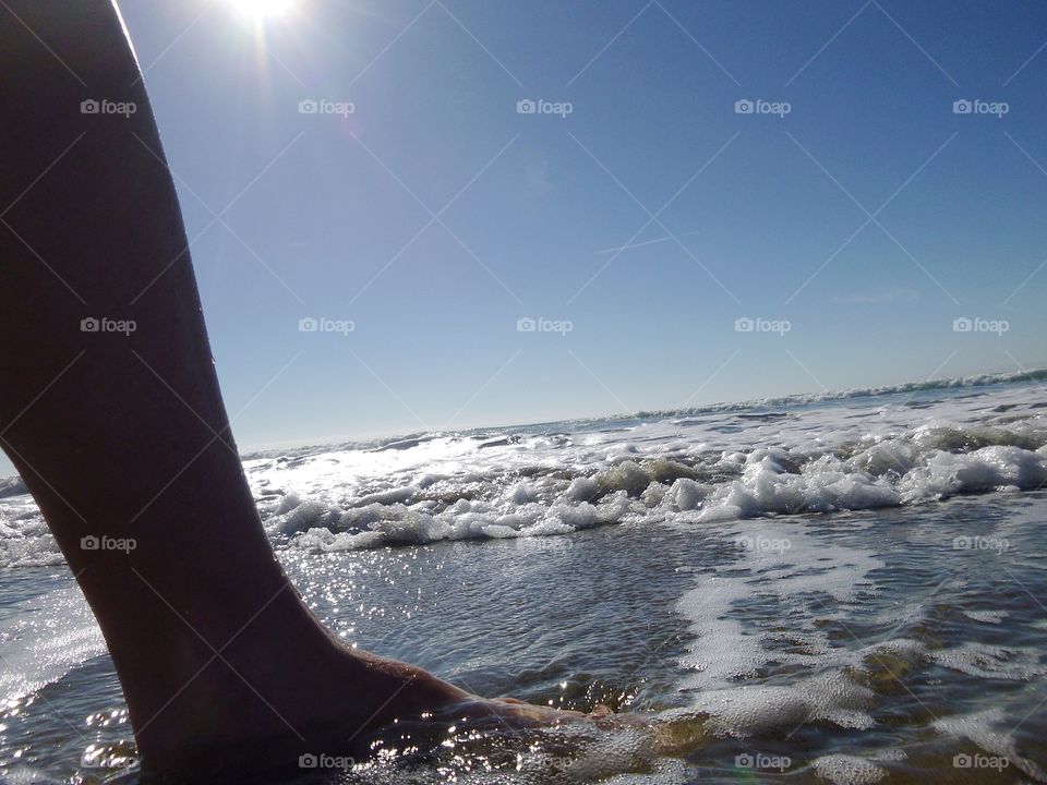 Foot in ocean