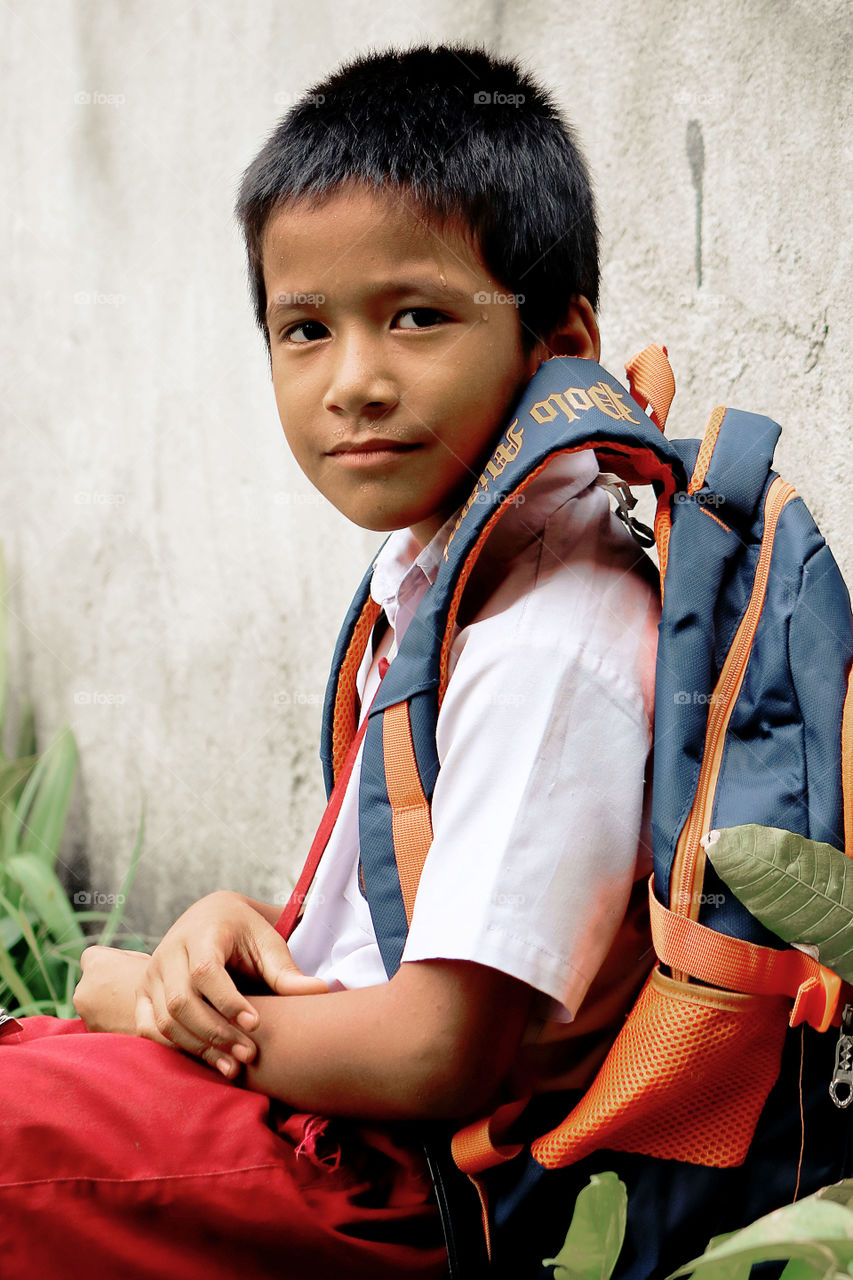 Happy smiling kid going to school