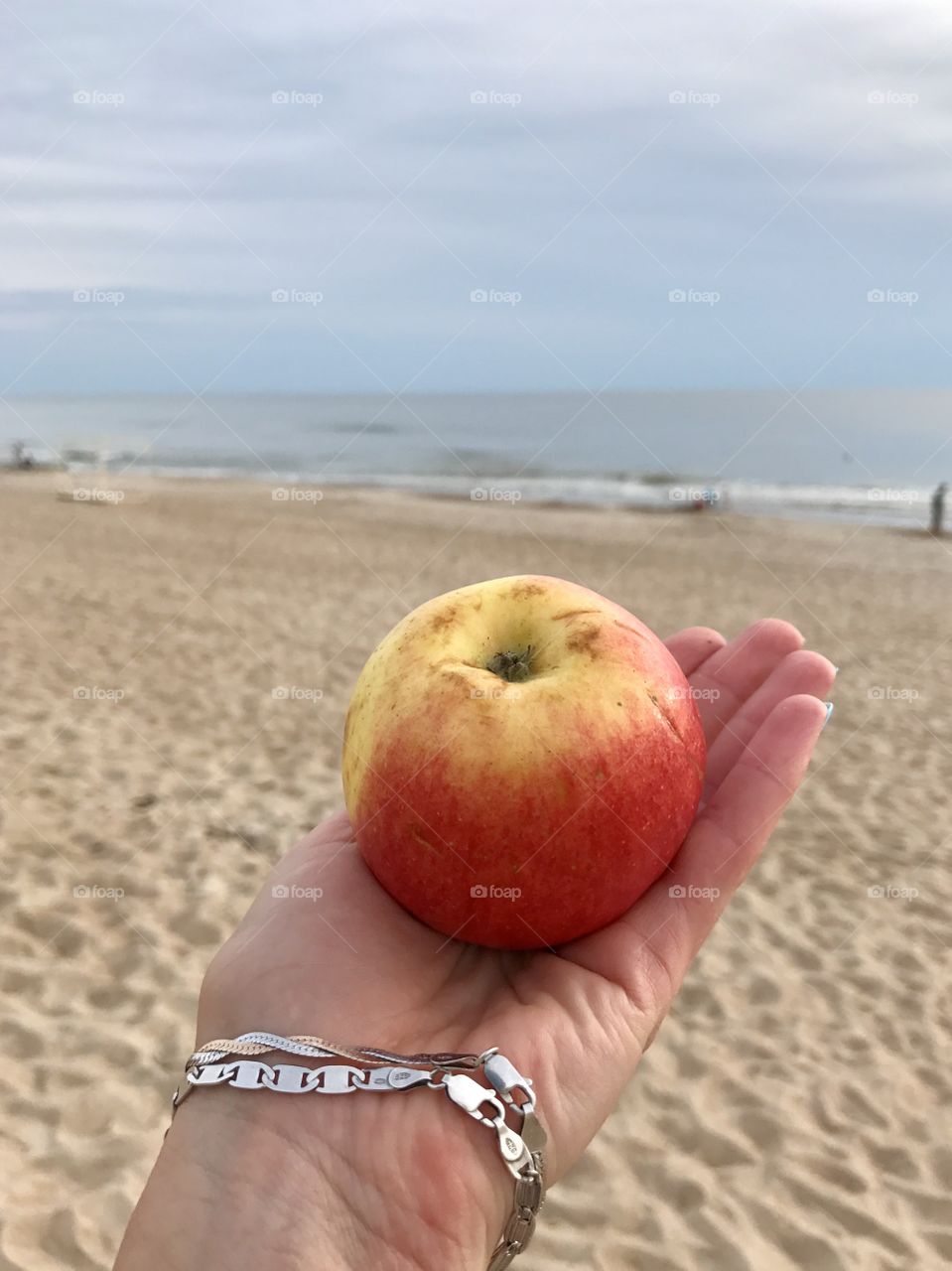 Apple in front of the sea