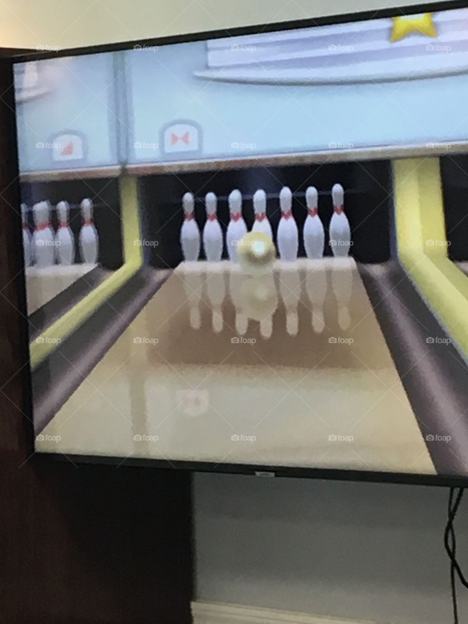 Wii bowling at the senior center,practicing for a wii bowling tournament! they have fun.