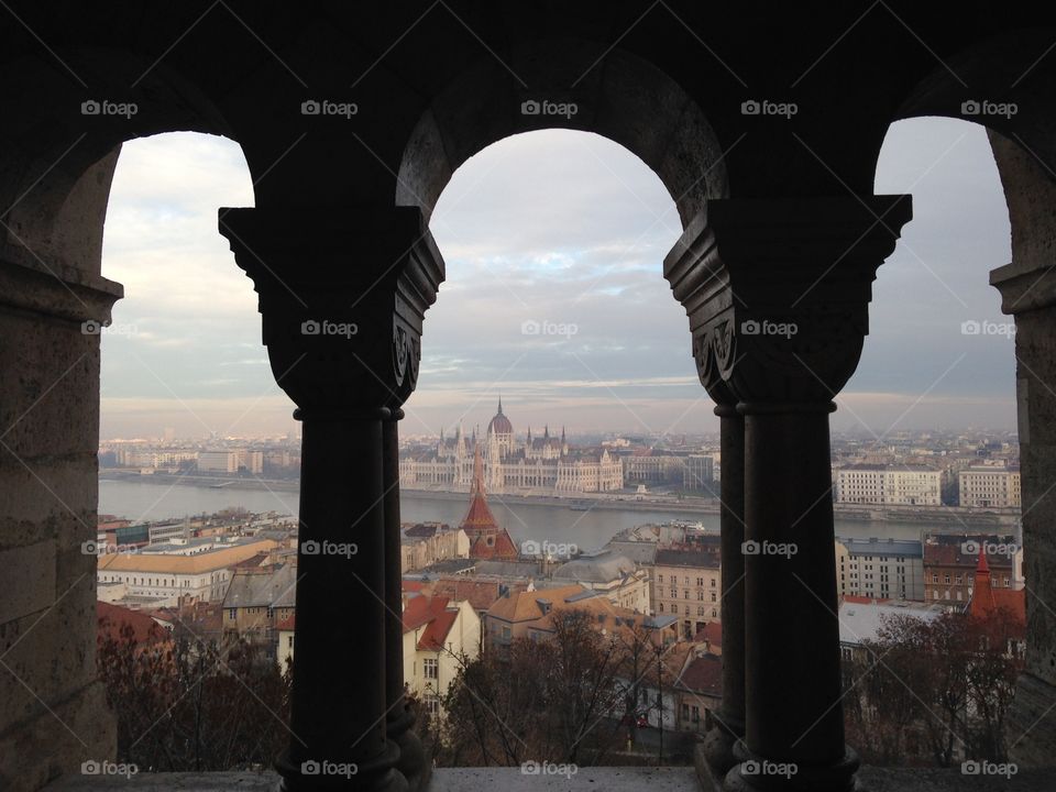 Discovering Budapest. City view through the arches 