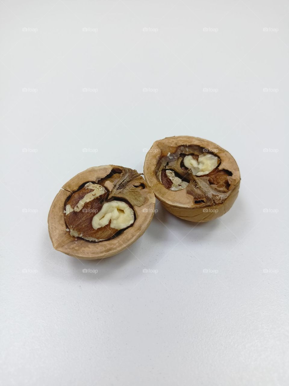 walnut split in half, shell, walnut, food, white background, minimalism, abstraction, shadows