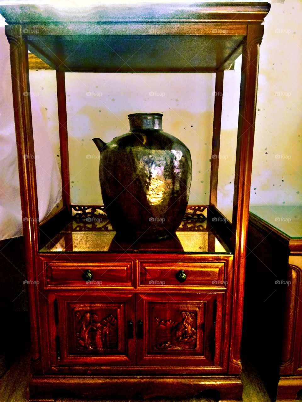 The jar in the ancient times and the shapes of those small cabinet doors  in the bottom was carved and shapes into trees and mountains and etc. in South Korea