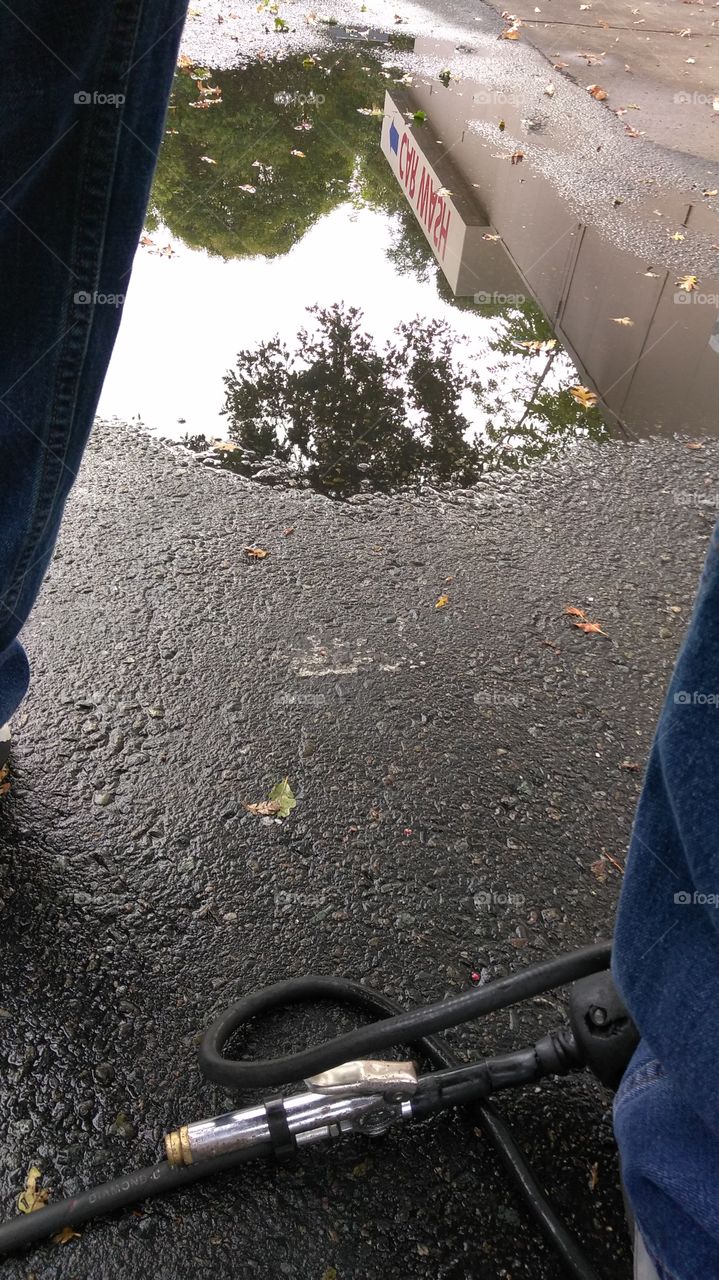 upside down reflection photography, while airing up my tire in a gas station parking lot.