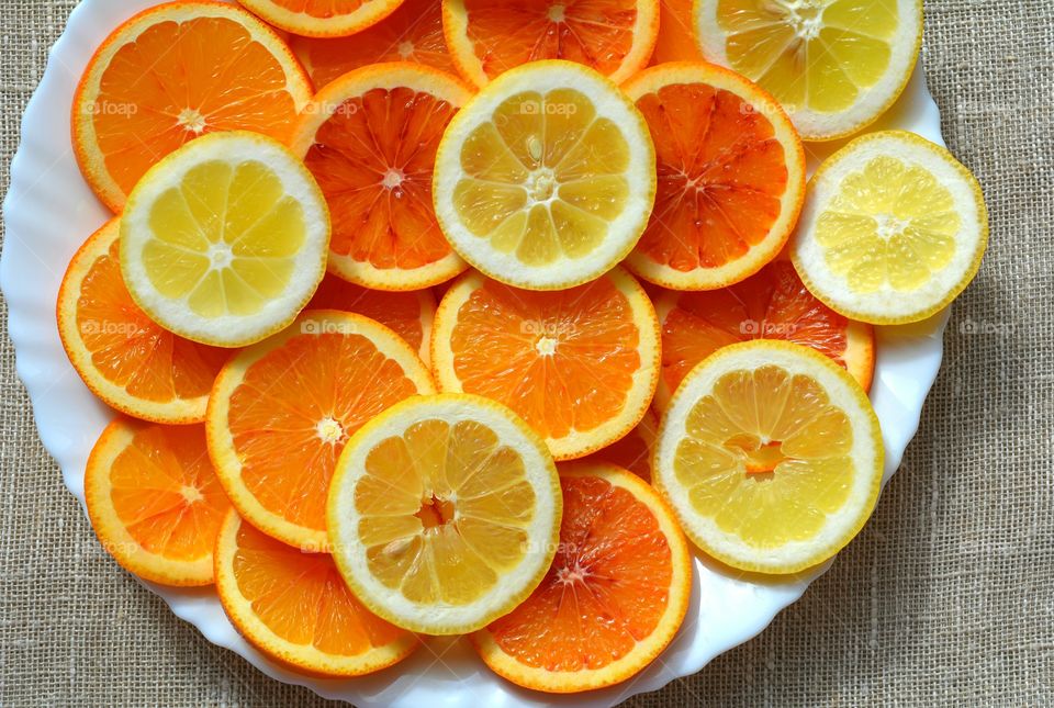 orange citrus fruits on a plate texture background