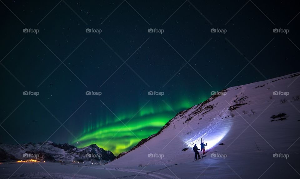 skiing under the Northern lights