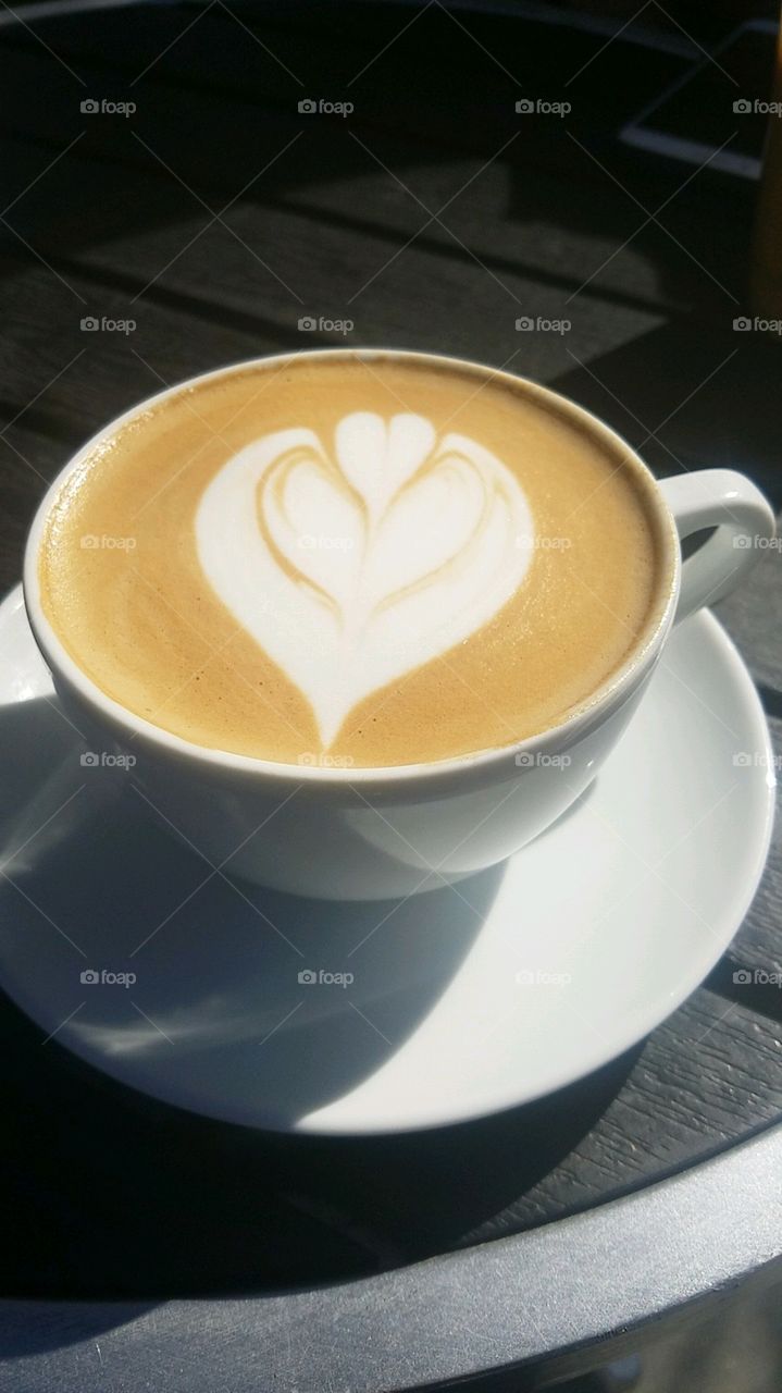 Latte art in a clean crisp white mug
