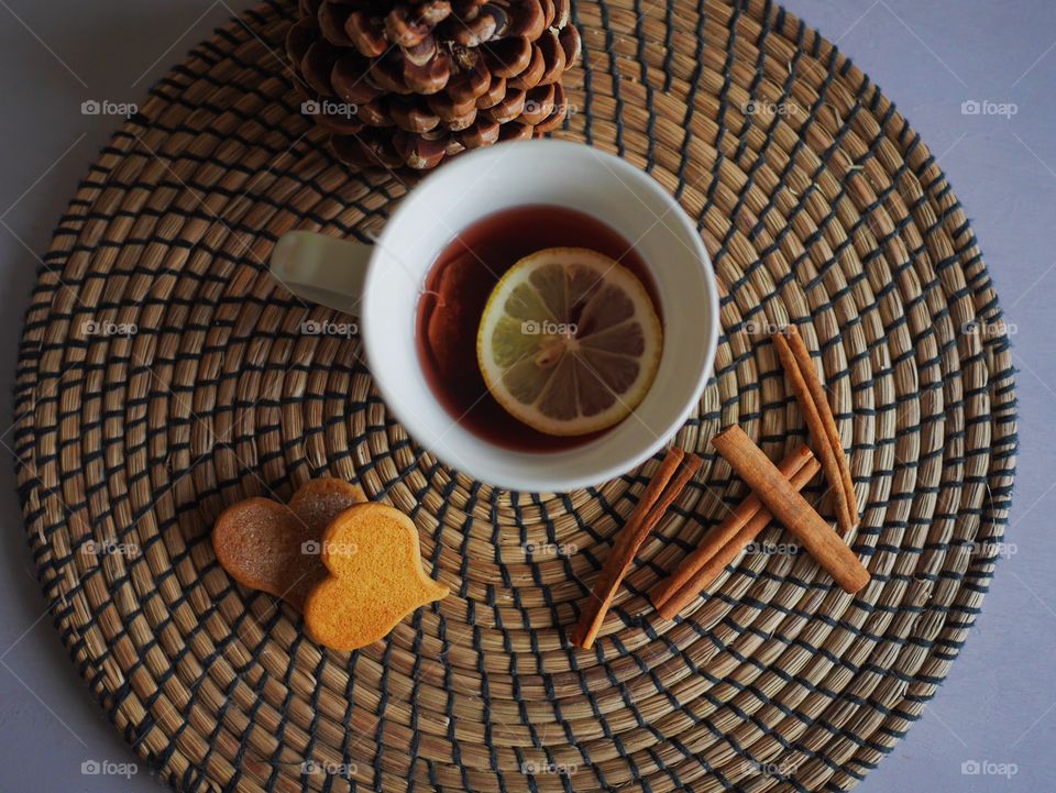 Cookie and tea on table mat