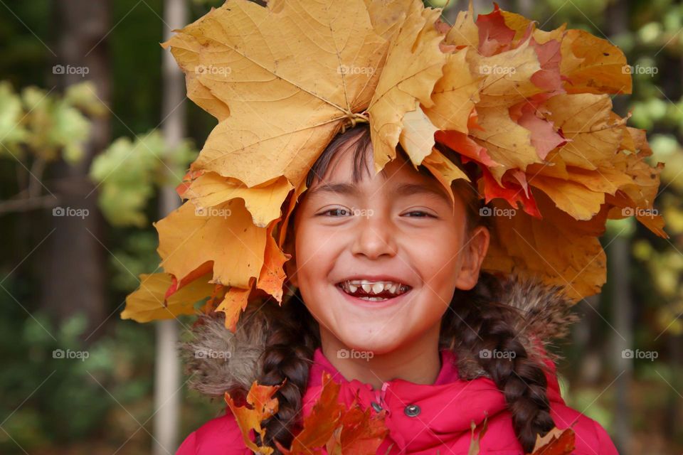 Happy girl in a leaf crown