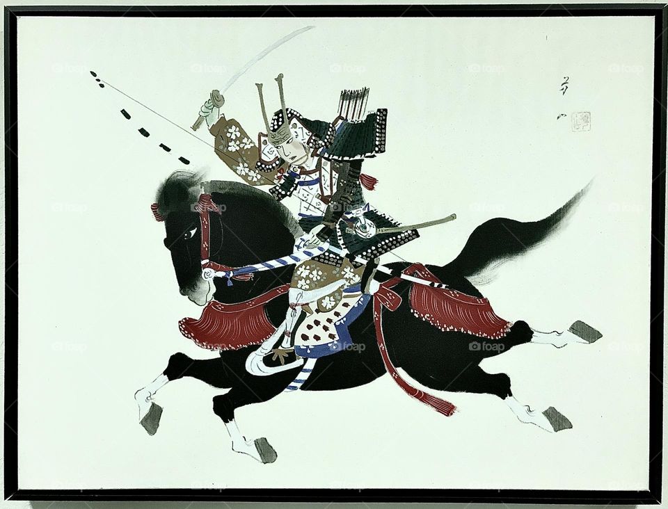 A period artwork depicting a mounted female samurai charging into action.
