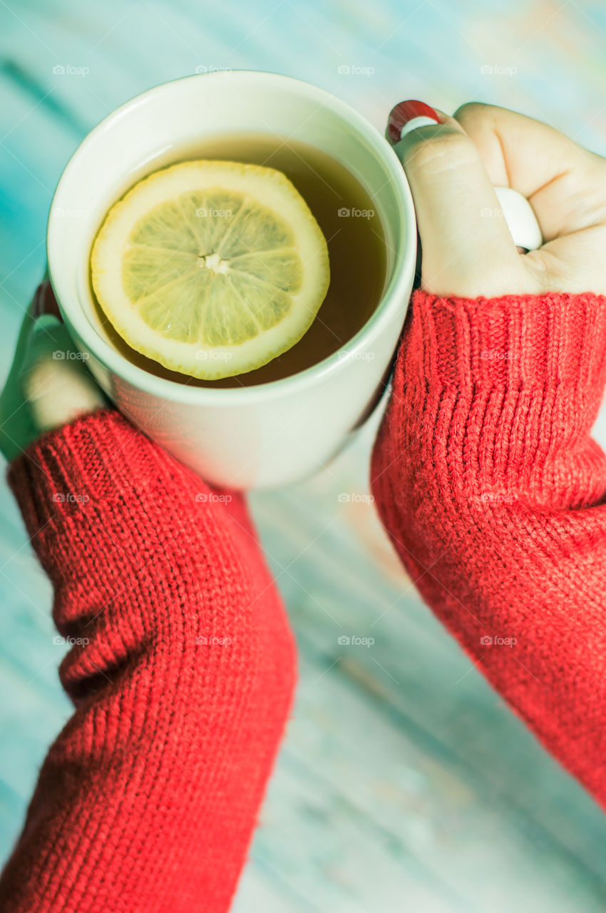 woman hand with cup of tea