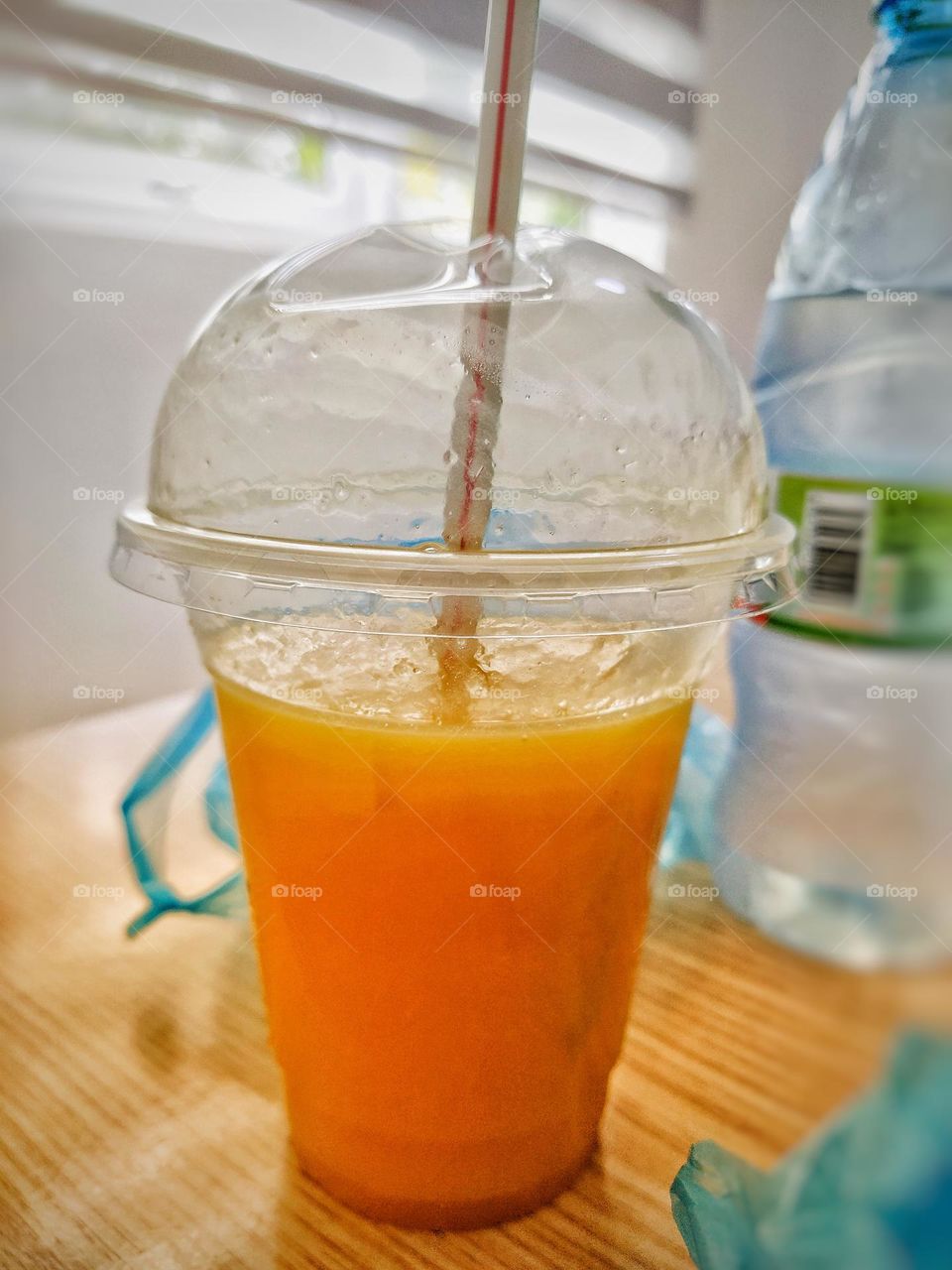 delicious mango juice in a plastic container