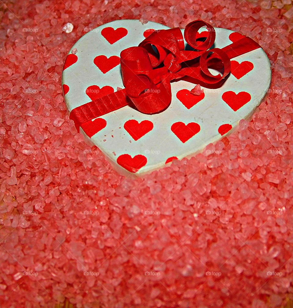 The best known, universal symbol of love is the heart-shaped ideograph, and it symbolizes the core of romantic love, affectionate emotion and caring.