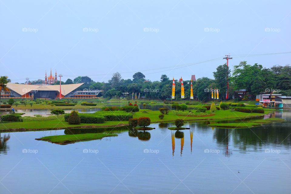 water reflection on a pond, inside the Indonesia Miniature Garden in Jakarta, Indonesia. taken in the afternoon, approaching sundown.