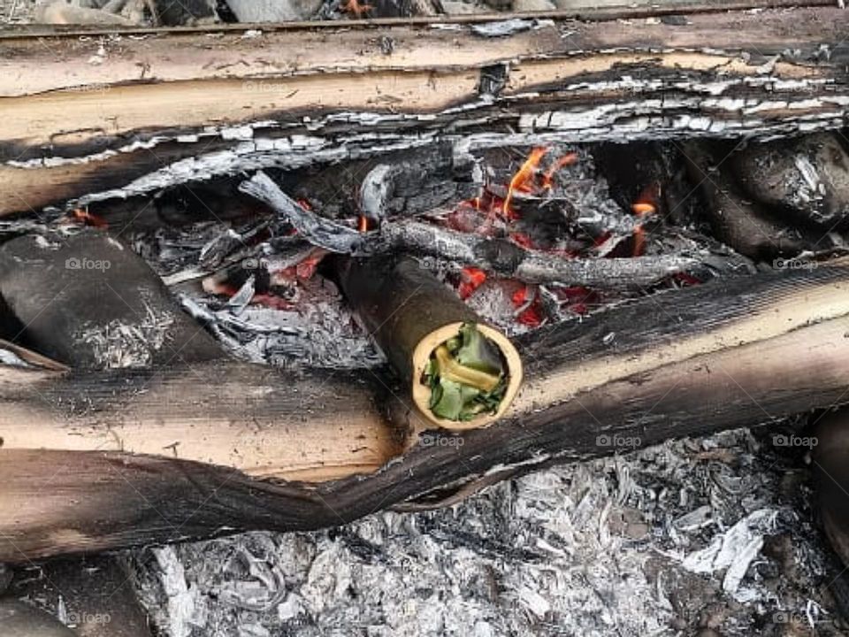 fire and Bamboo cook fish