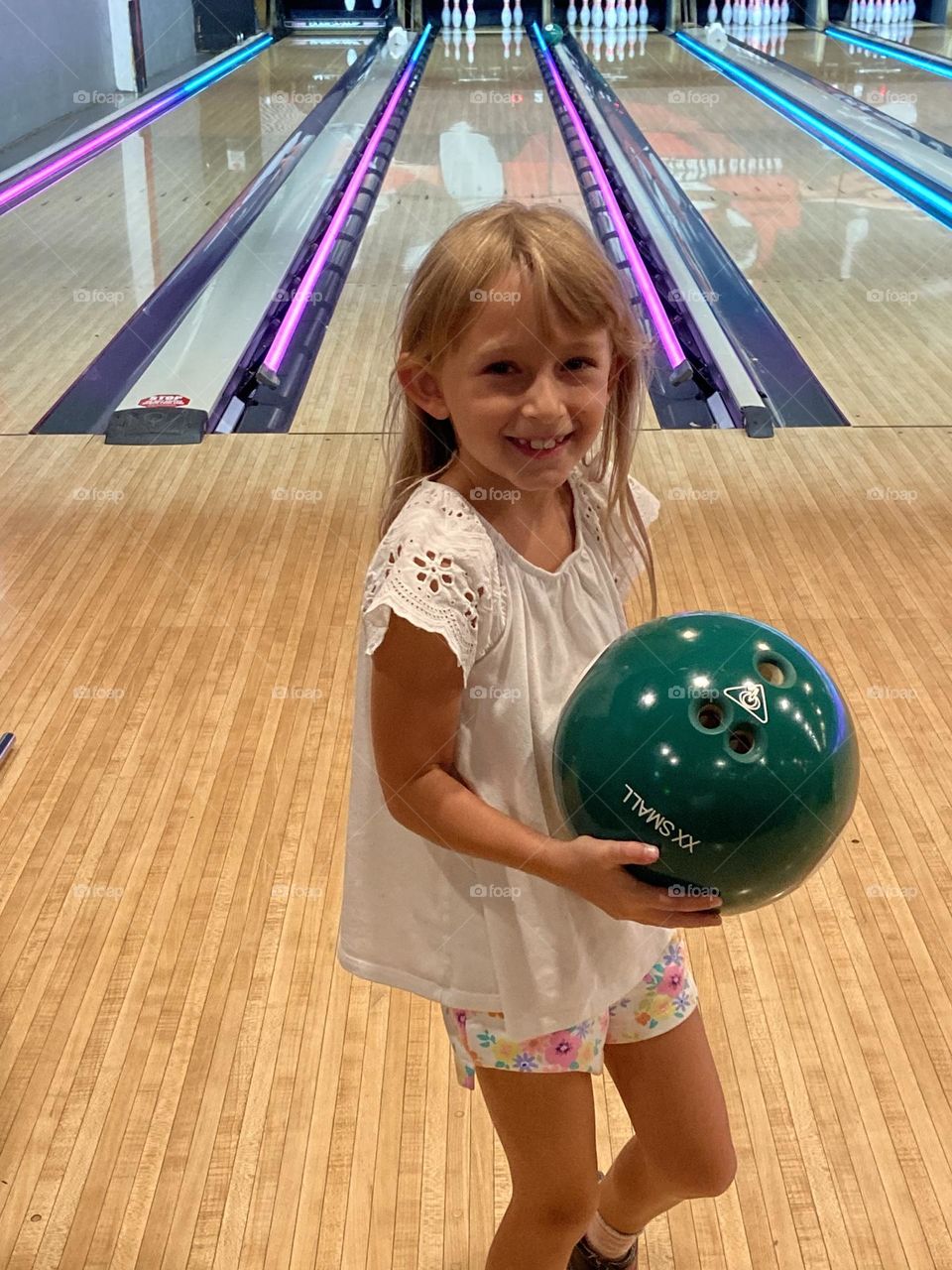 Little girl having some bowling fun! 