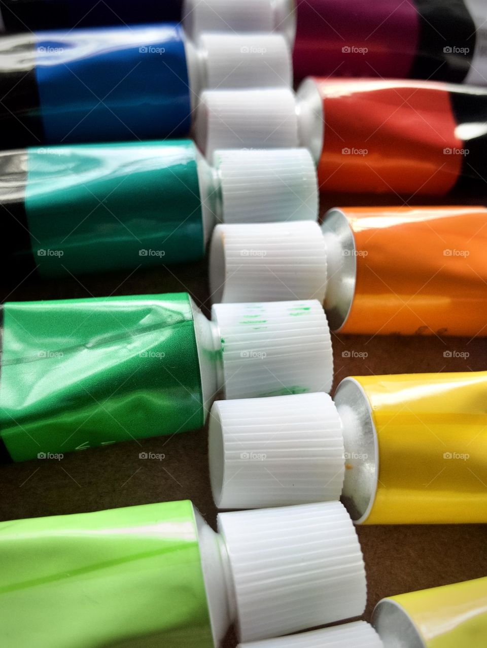 Closeup of metallic tubes of oil paints