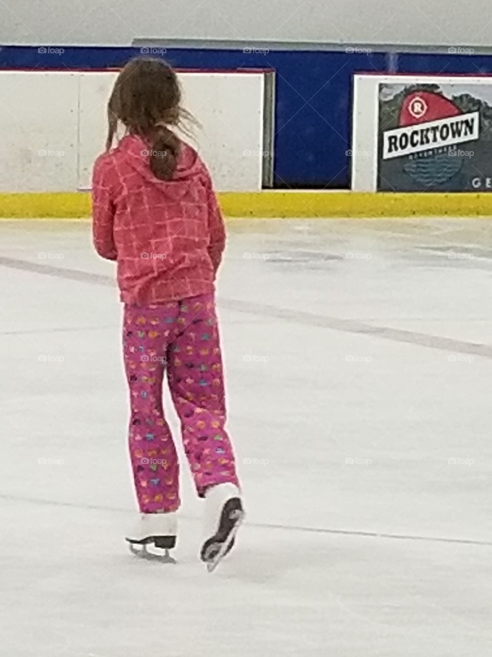 older girl ice skating