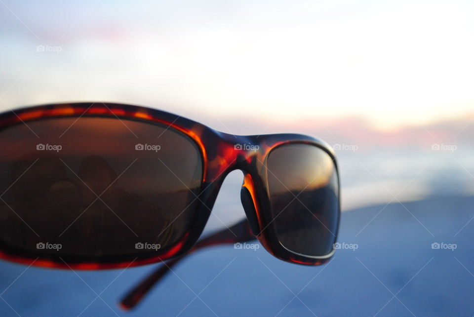 Sunglasses at sunset at the beach