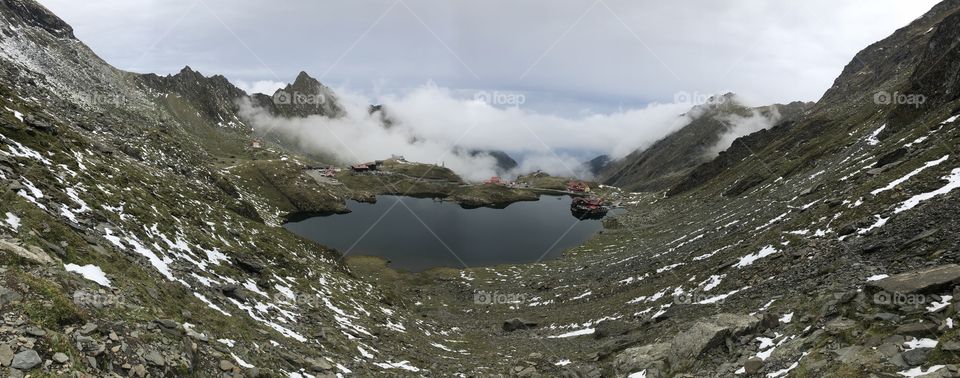 Balea lac at the top of Transfagarasan. Foggy morning over the lake
