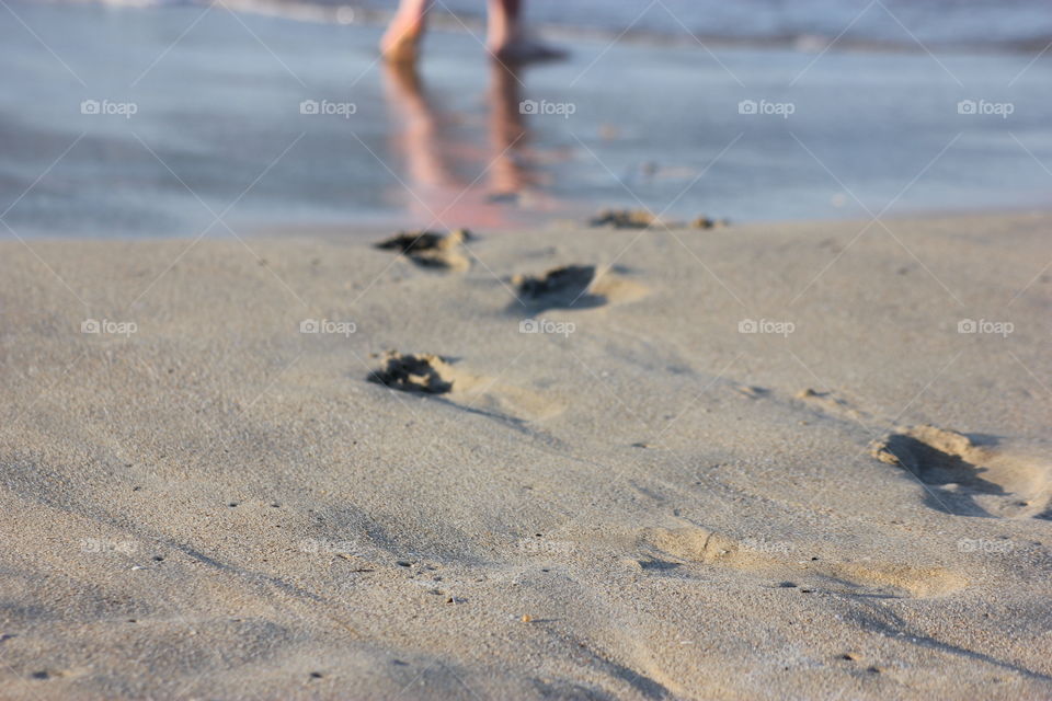 Footsteps in the sand . Blue 