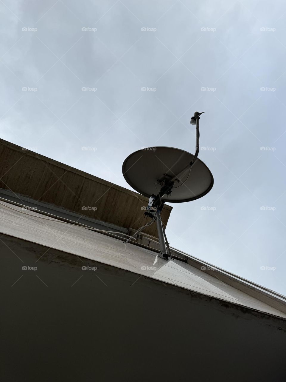 A photo of the satellite dish installed on the terrace wall