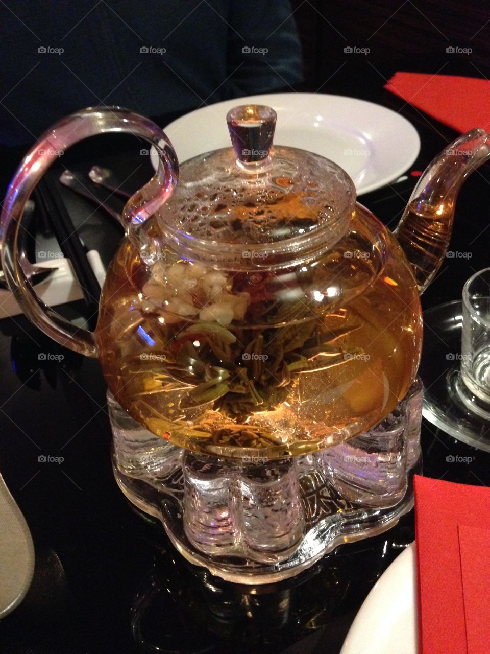 Chinese oriental Jasmine tea made with real flower which opens as it brews in glass teapot