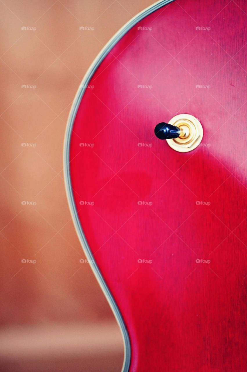 Abstract image, red colored part of guitar, abstract red, round shape