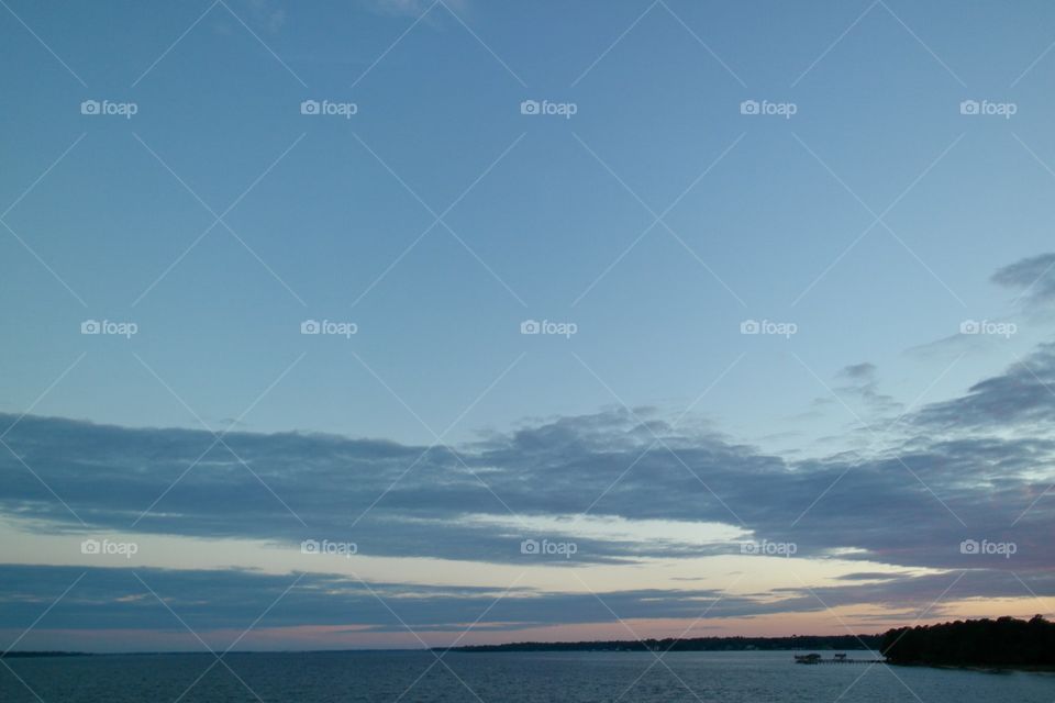 Cloudy skies over water 
