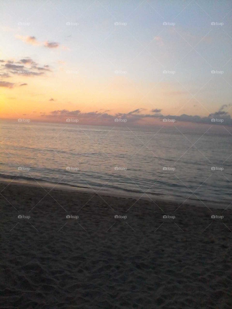 the color in the sky is very beautiful to see and the ocean is so warm and still ever one enjoy it.