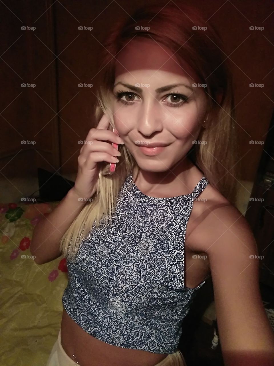 Portrait of stylish woman holding smartphone