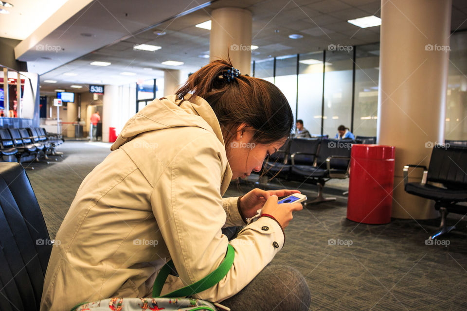 Girl playing smartphone 