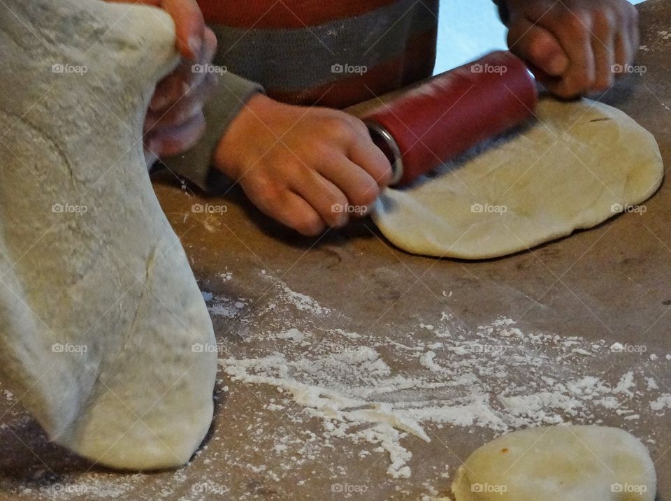 Baking At Home. Rolling Dough To Bake Bread At Home
