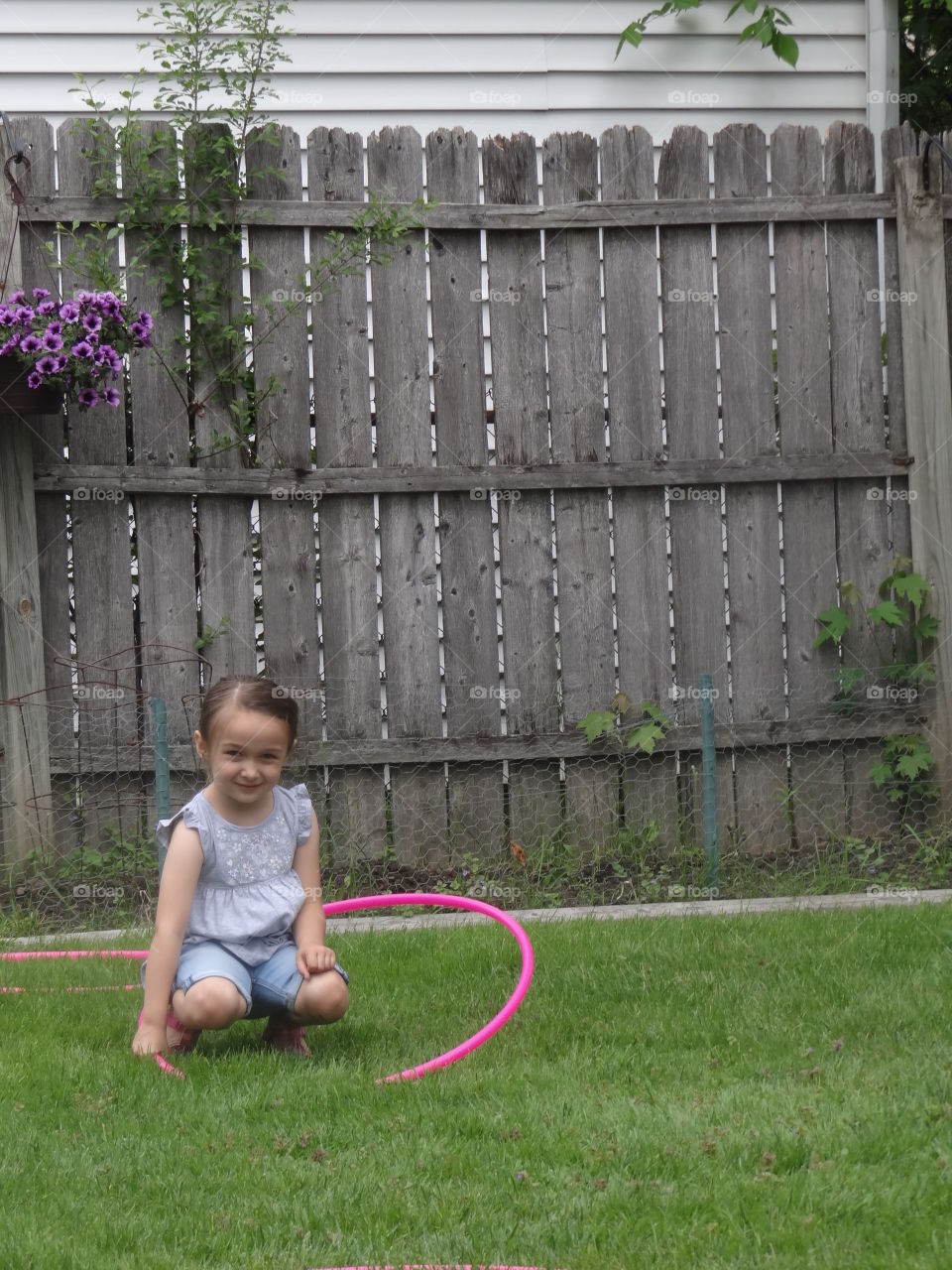 Hula Hoop Baby. Girl, attempting to hula hoop