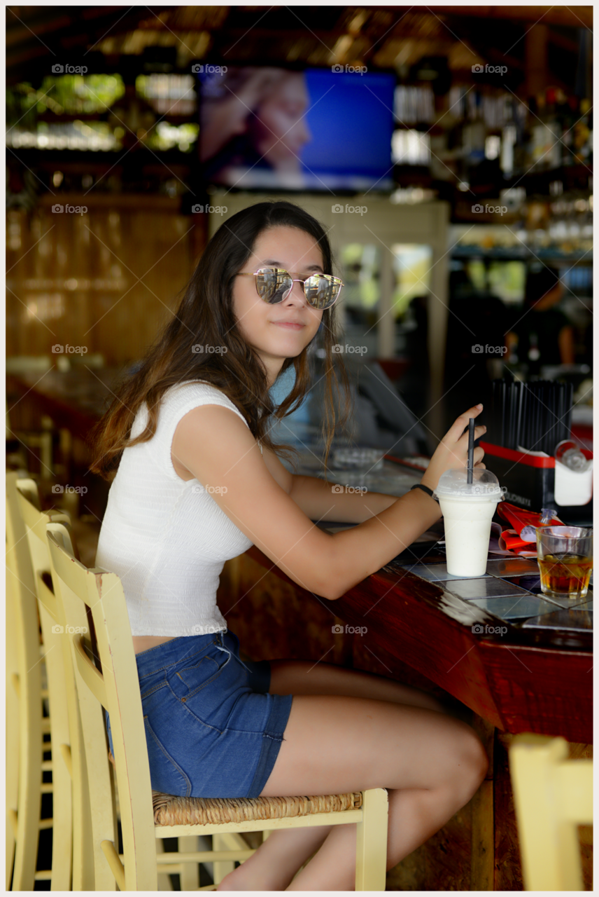 Young woman sitting in restaurant