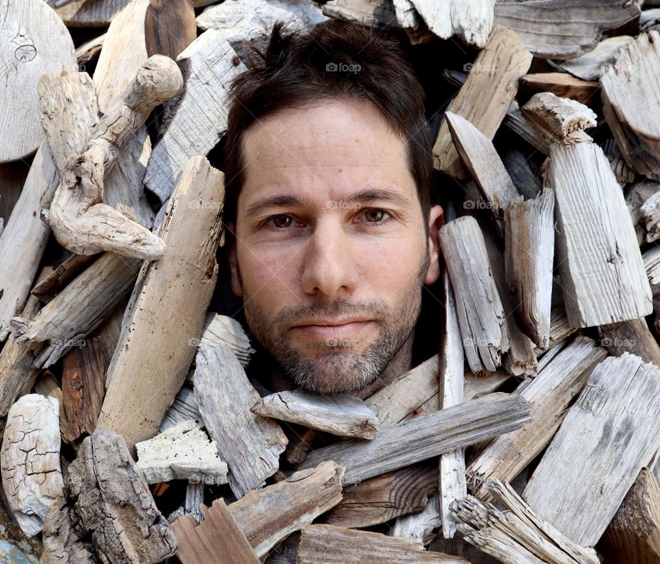 This is my husband.Guy. He is an artist who collect and create with driftwood. Show the fragility and humanity inside each of us through the broken scratched woods