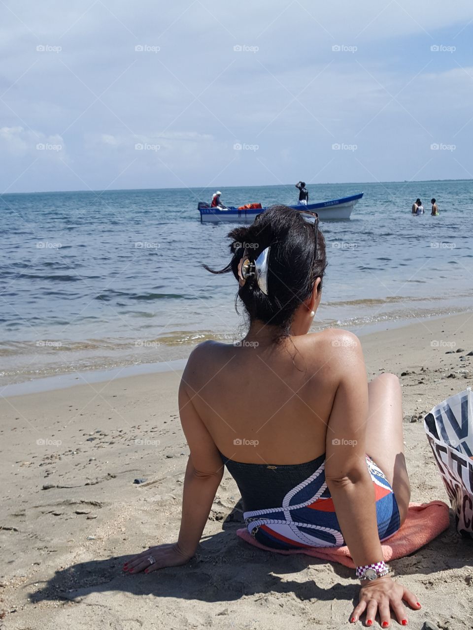 tomando el sol y viendo a los navegantes