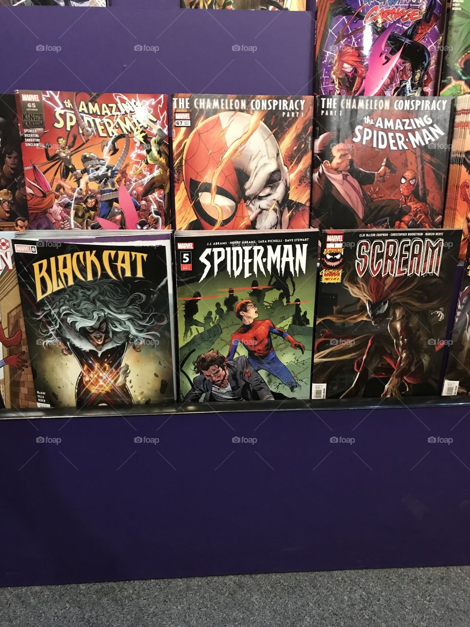 Comic books from Marvel Comics on the rack. They are available at HEROES comic store. The popular ones are the SPIDER-MAN titles.