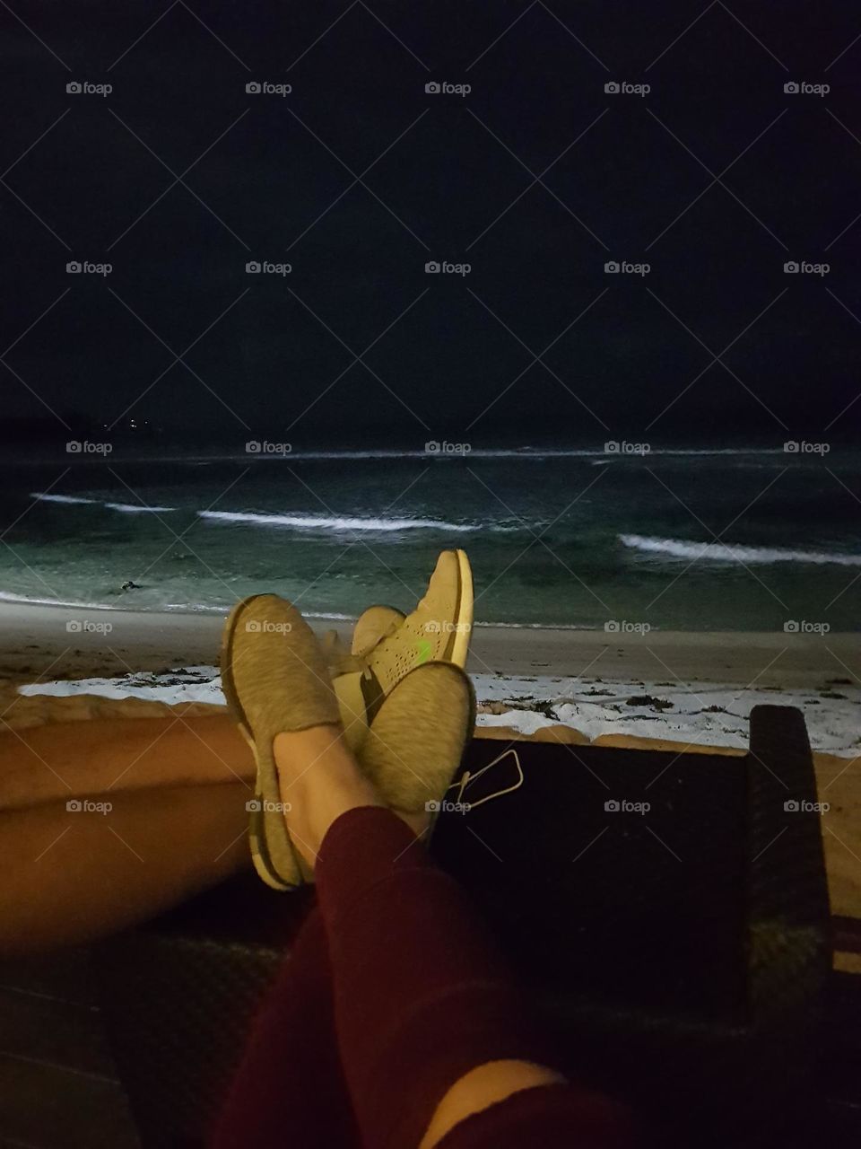 Listening the sound of the waves during the night